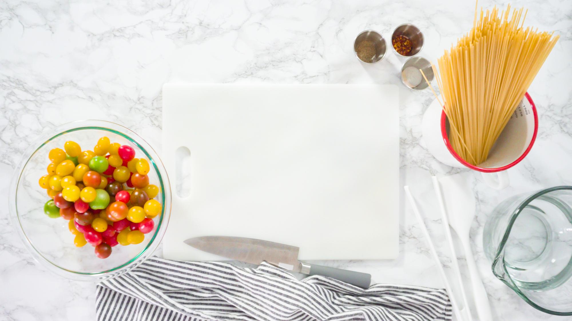 studio counter with plated meal and recipe card